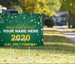 Green yard sign that says congratulations